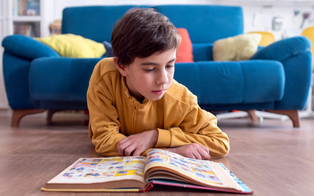 Kid reading graphic novel at home