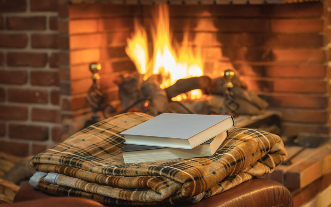 Cozy mysteries in front of a fireplace