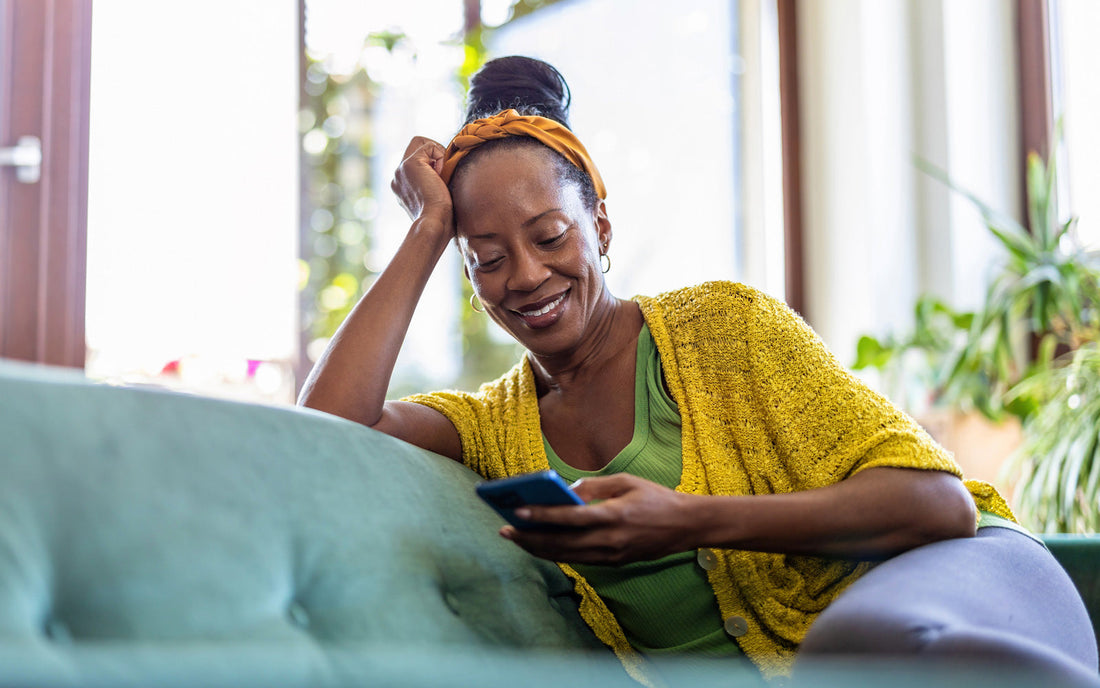 Woman reads an e-book on her phone using the Bookshop.org app
