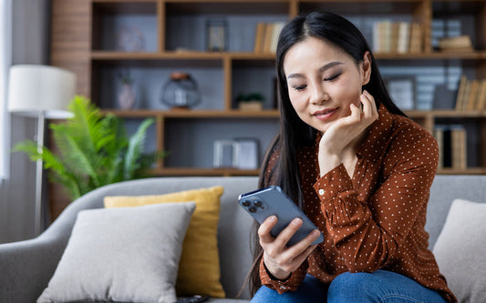 Woman using a phone for tracking books