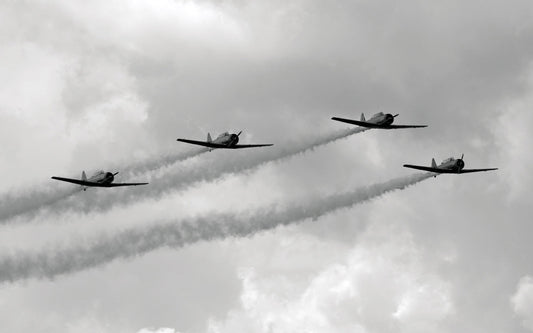 Four WWII planes flying