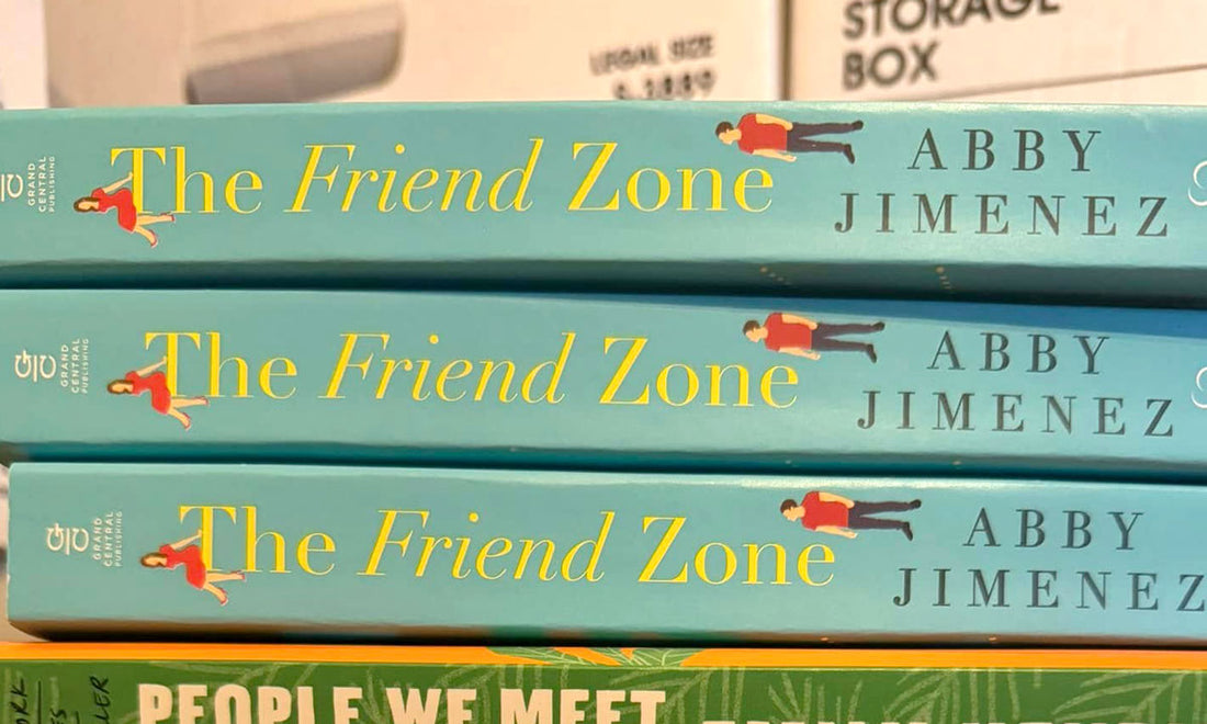 The Friend Zone by Abby Jimenez book stack