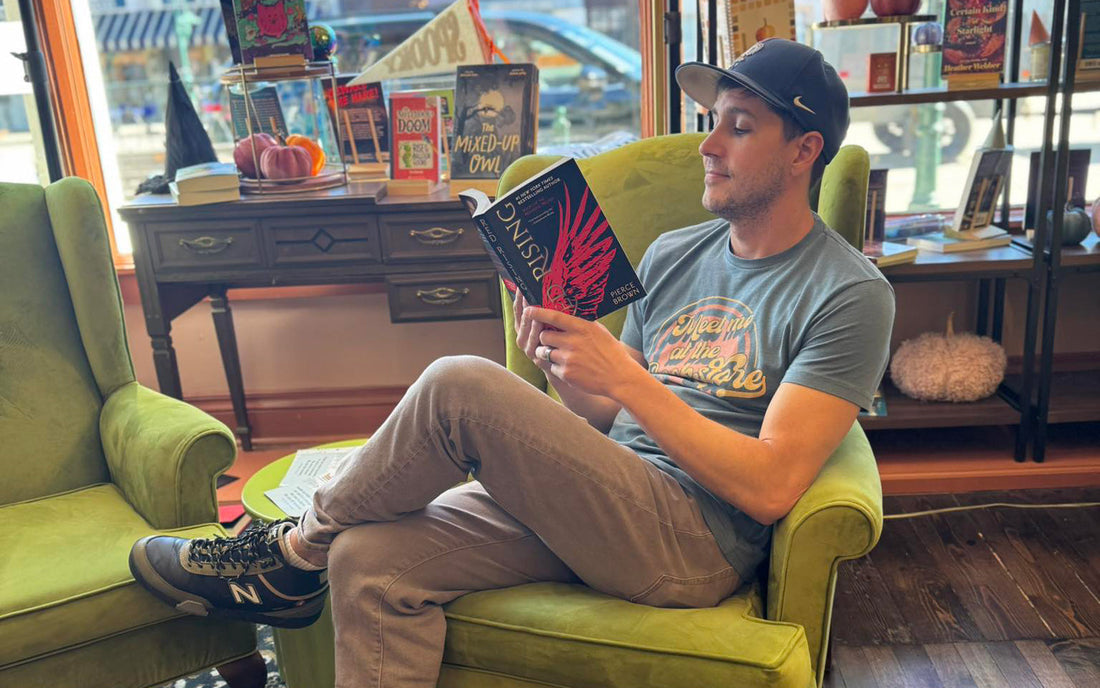 Owner Elliot May reading inside Novel