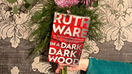 Ruth Ware's In a Dark Dark Wood with floral bouquet
