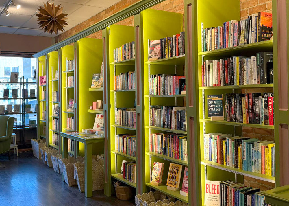 Bookshelves full of book selections for Book Club