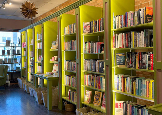 Bookshelves full of book selections for Book Club