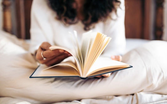 Woman flips through the pages of a book