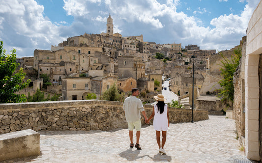 couple walks holding hands in a romantic setting