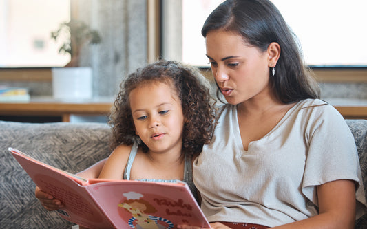 Mom reads aloud to her daughter