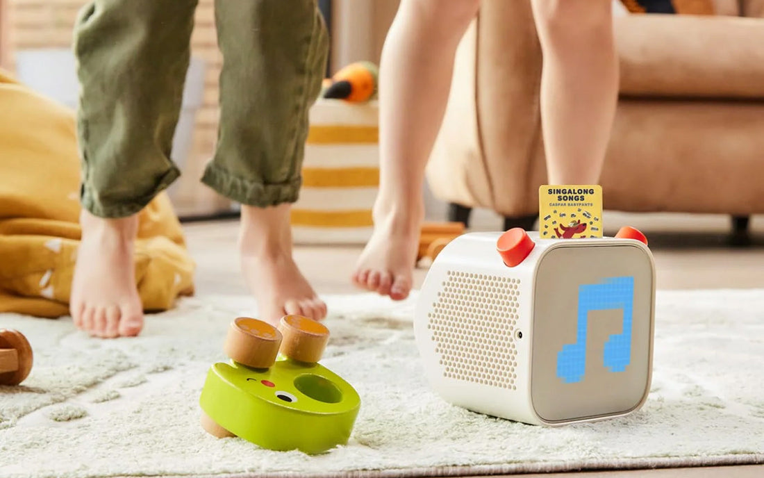 Kids dancing to songs on a Yoto Player